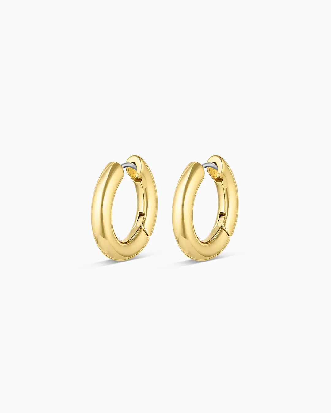 Gold hoop earrings on a white background