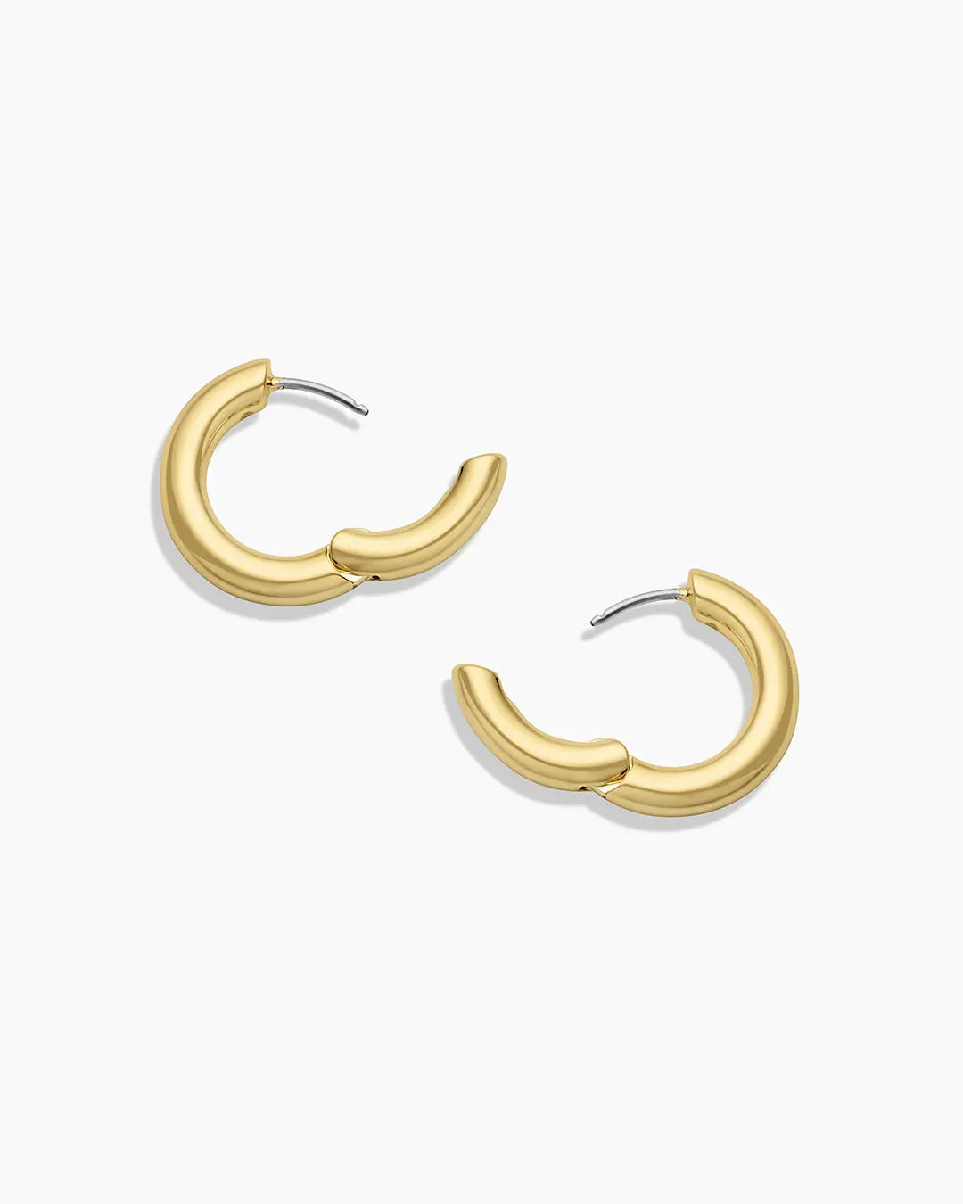 Gold hoop earrings on a white background