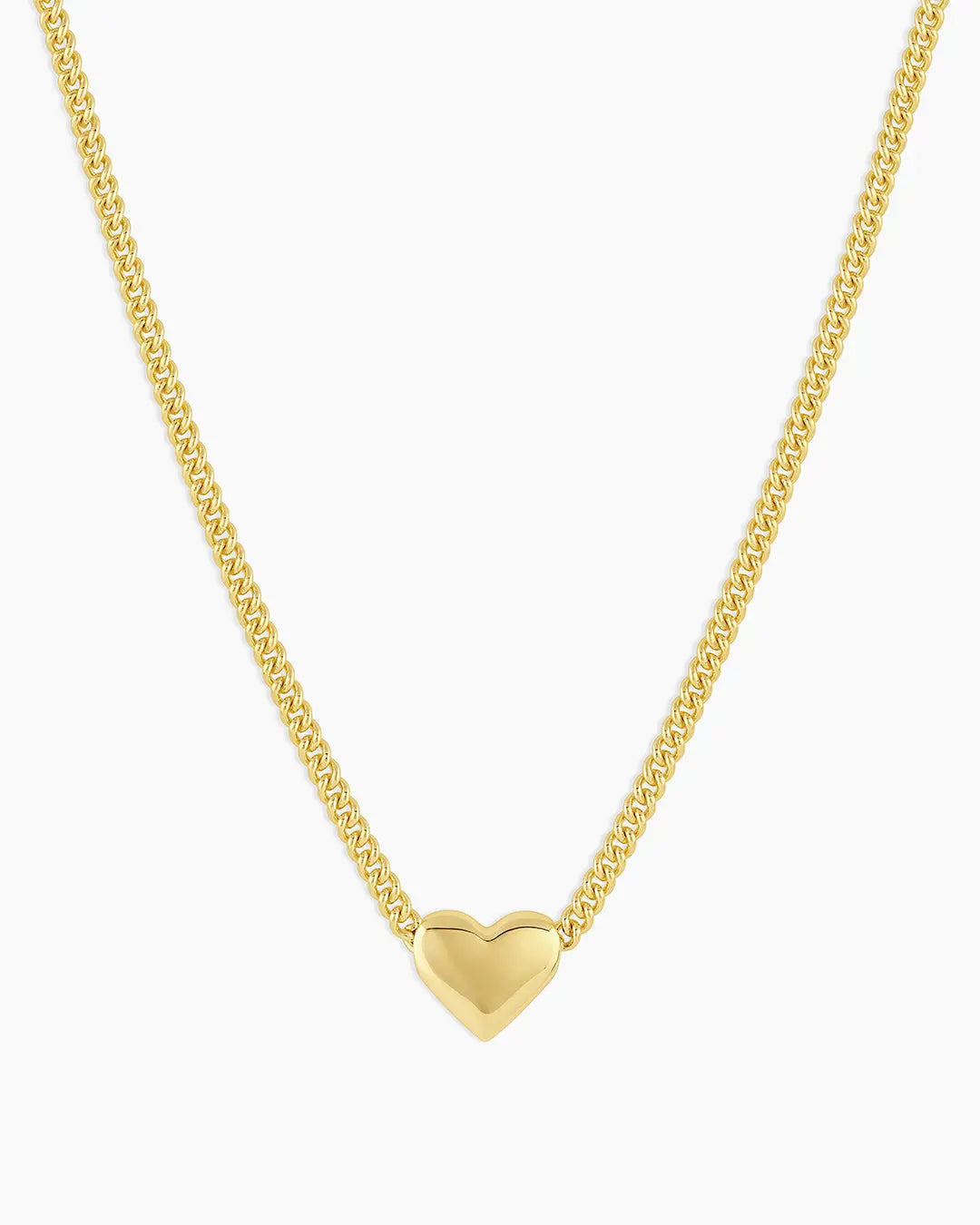 Gold heart-shaped pendant necklace on a white background
