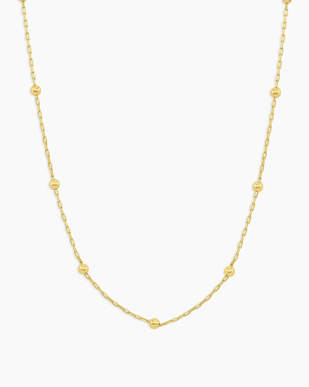 Gold necklace on a white background