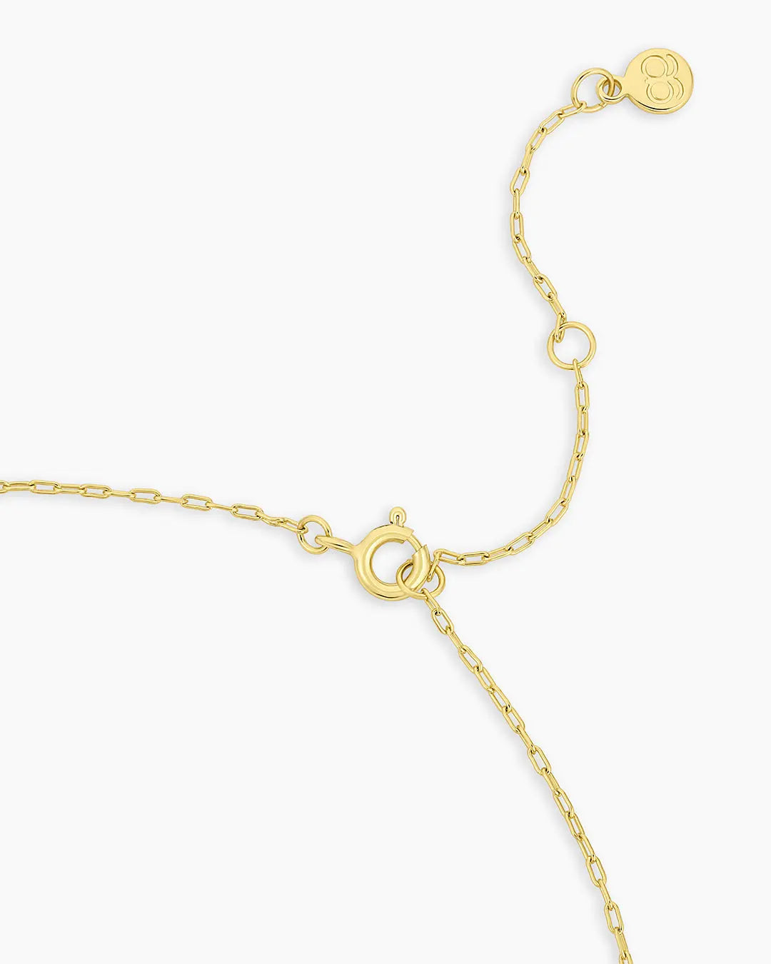 Gold bracelet on a white background