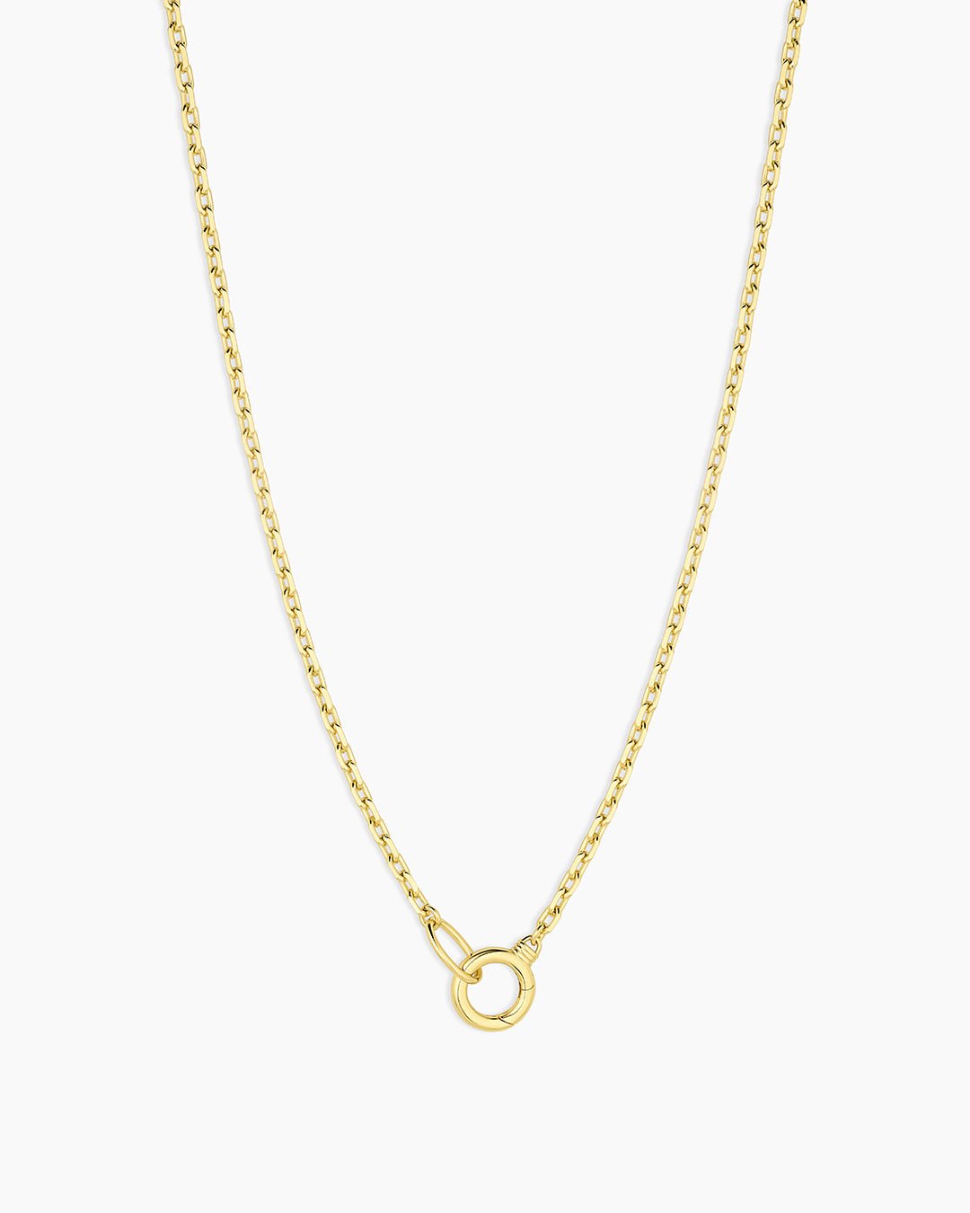 Gold necklace with a small round pendant on a white background