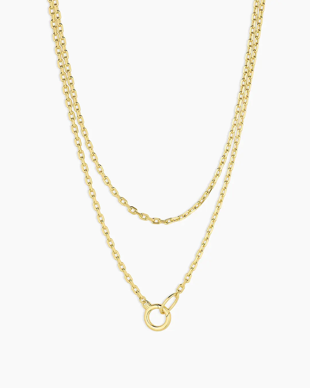 Two gold necklaces on a white background