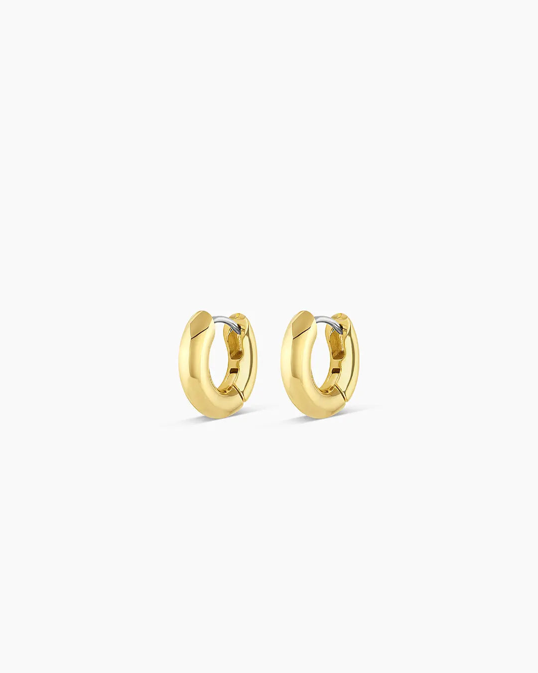 Pair of gold hoop earrings on a white background
