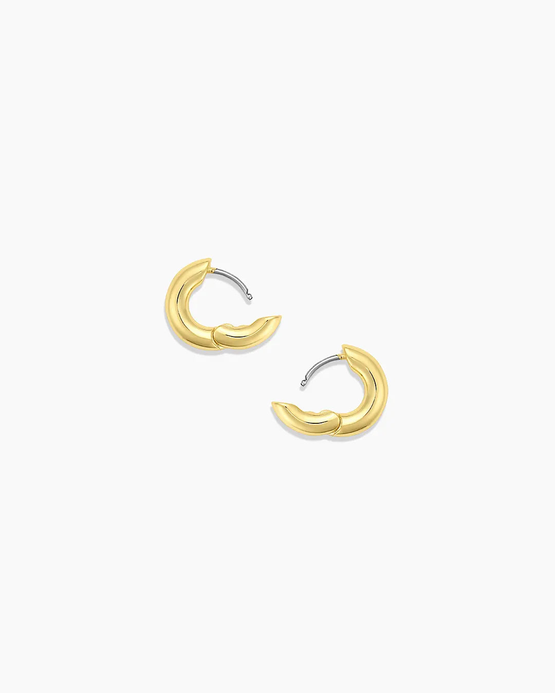 Gold hoop earrings on a white background