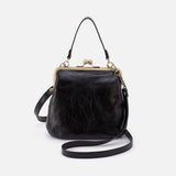 Black leather handbag with gold clasp on a white background
