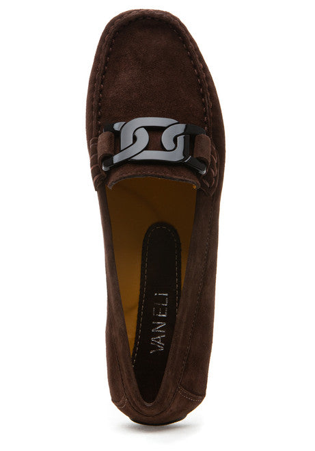 Brown suede loafer with a decorative buckle on a white background