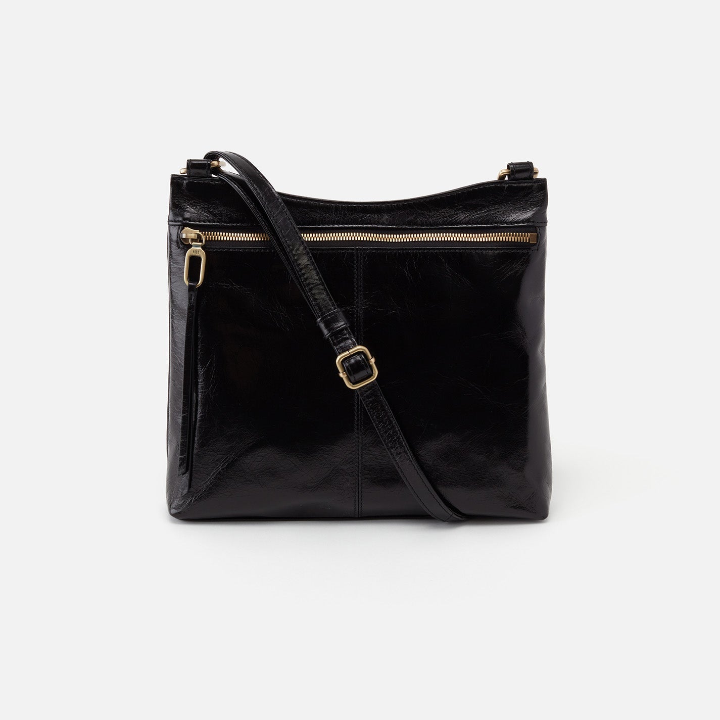 Black leather handbag with a shoulder strap on a white background