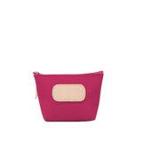 Pink pouch with beige patch on a white background