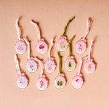 Set of decorative items with various designs on a beige background