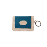 Blue and beige cardholder with keychain on a white background