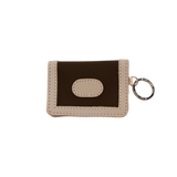Small brown and beige wallet with a keychain on a white background