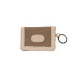 Small beige wallet with a key ring on a white background