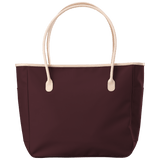 Maroon tote bag with beige handles on a transparent background