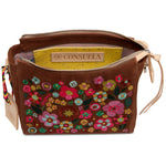Brown handbag with colorful floral embroidery and 'Consuela' brand label on a white background