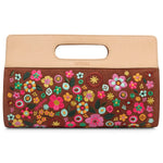 Floral embroidered clutch bag with beige top handle on a white background