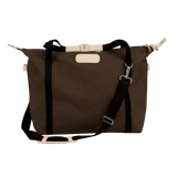 Brown tote bag with black straps on a white background