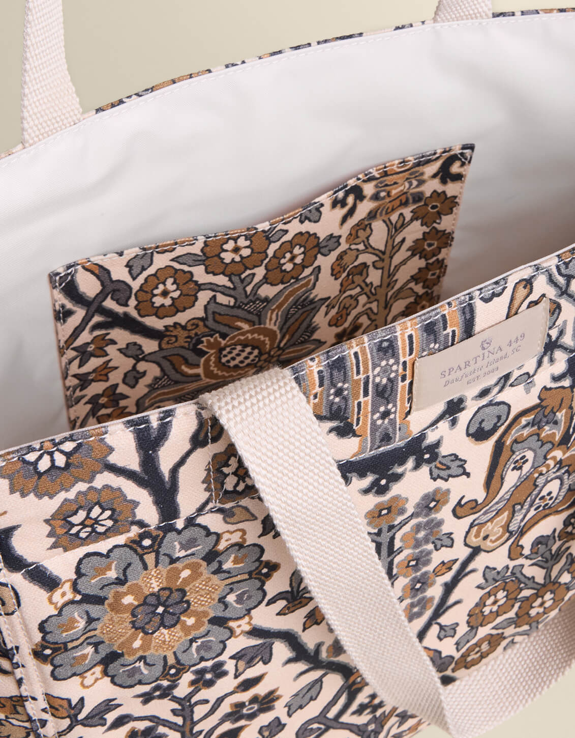 Patterned tote bags with visible branding on a neutral background