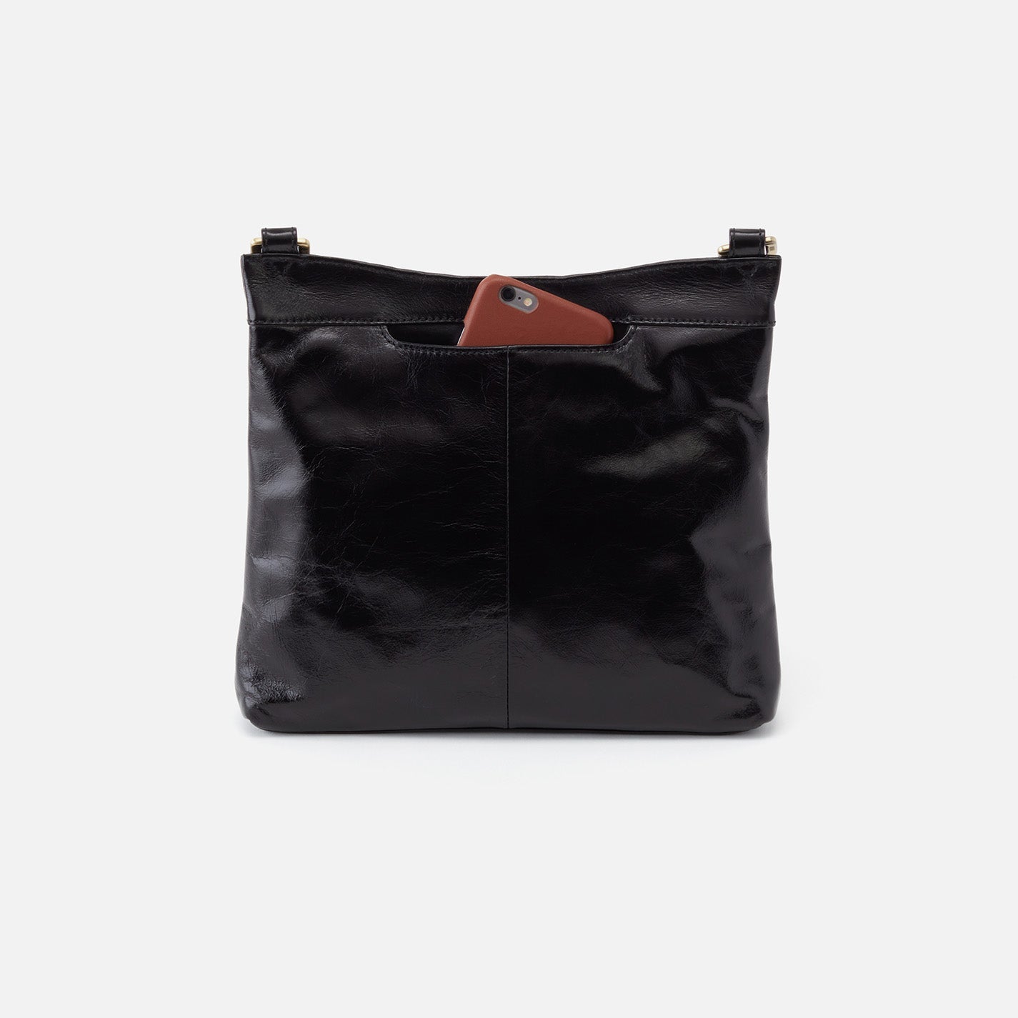 Black leather handbag with a brown patch on a white background