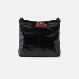 Black leather handbag with a brown patch on a white background