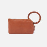 Brown leather pouch with braided handle on a white background
