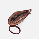 Brown leather clutch bag with a handle on a white background