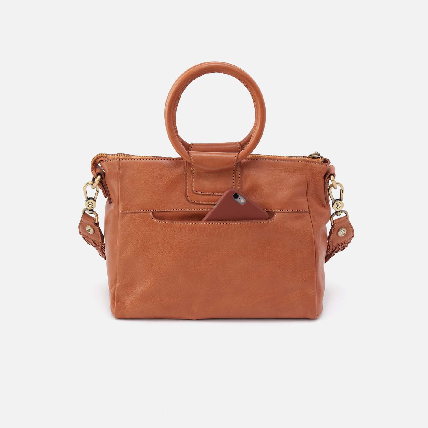 Brown leather handbag with gold accents on a white background