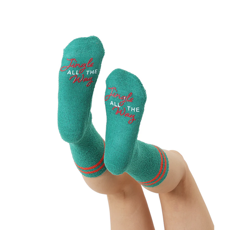 Teal socks with 'Jingle All The Way' text on a white background