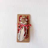 Metal snow shovel with gingerbread man design on a white background