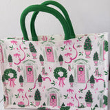 Tote bag with festive design featuring trees, wreaths, and pink bows on a white background