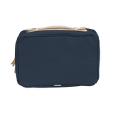 Navy toiletry bag with beige accents on a white background