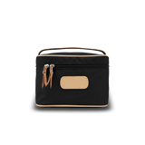 Black cosmetic bag with beige accents on a white background