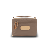 Brown cosmetic bag with a handle on a white background