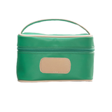 Green cosmetic bag with beige handle and patch on a white background