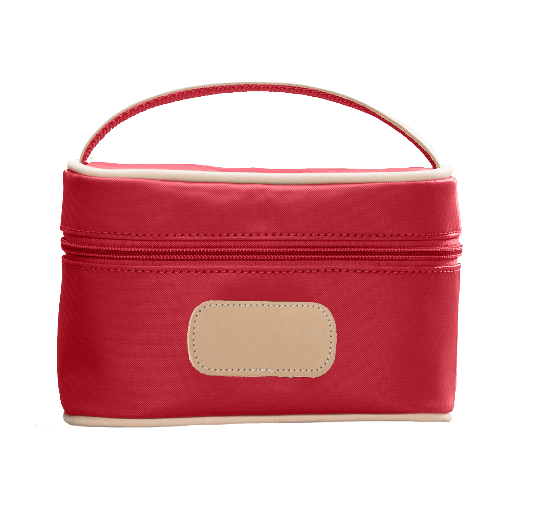 Red cosmetic bag with beige handle and patch on a black background