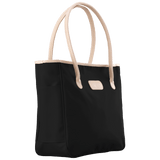 Black tote bag with beige handles on a transparent background
