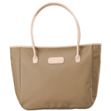 Beige tote bag with beige handles on a transparent background