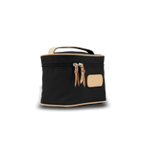Black cosmetic bag with beige accents on a white background