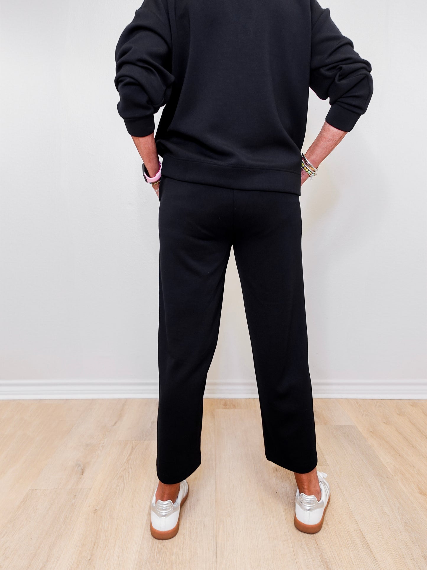 women modeling black pull on wide leg pants
