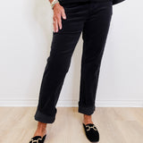 woman modeling black liverpool corduroy Markey girlfriend jeans against a white background.