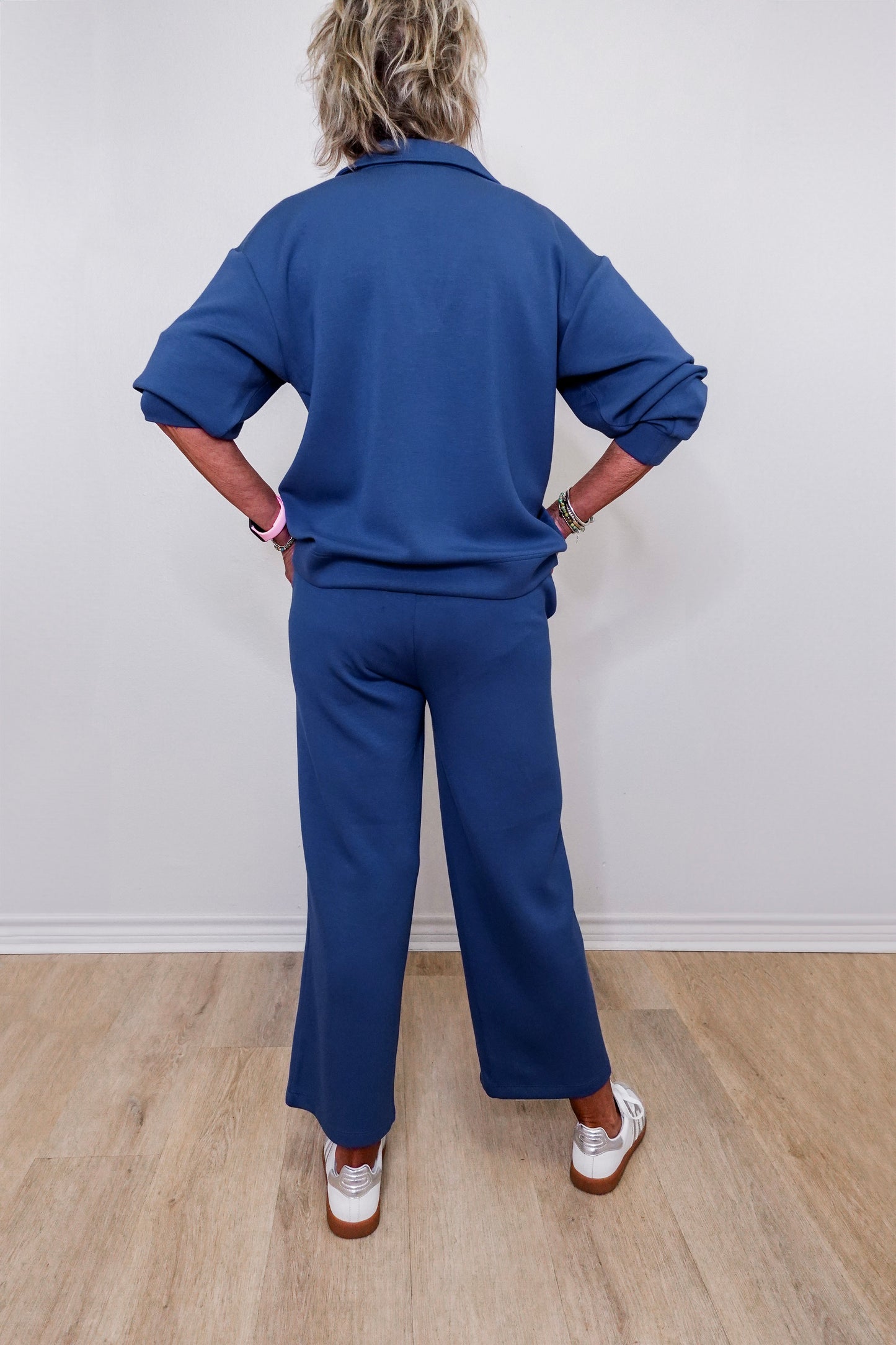 Casual Liverpool pacific blue pull-on wide leg cropped pants worn by woman against white backdrop