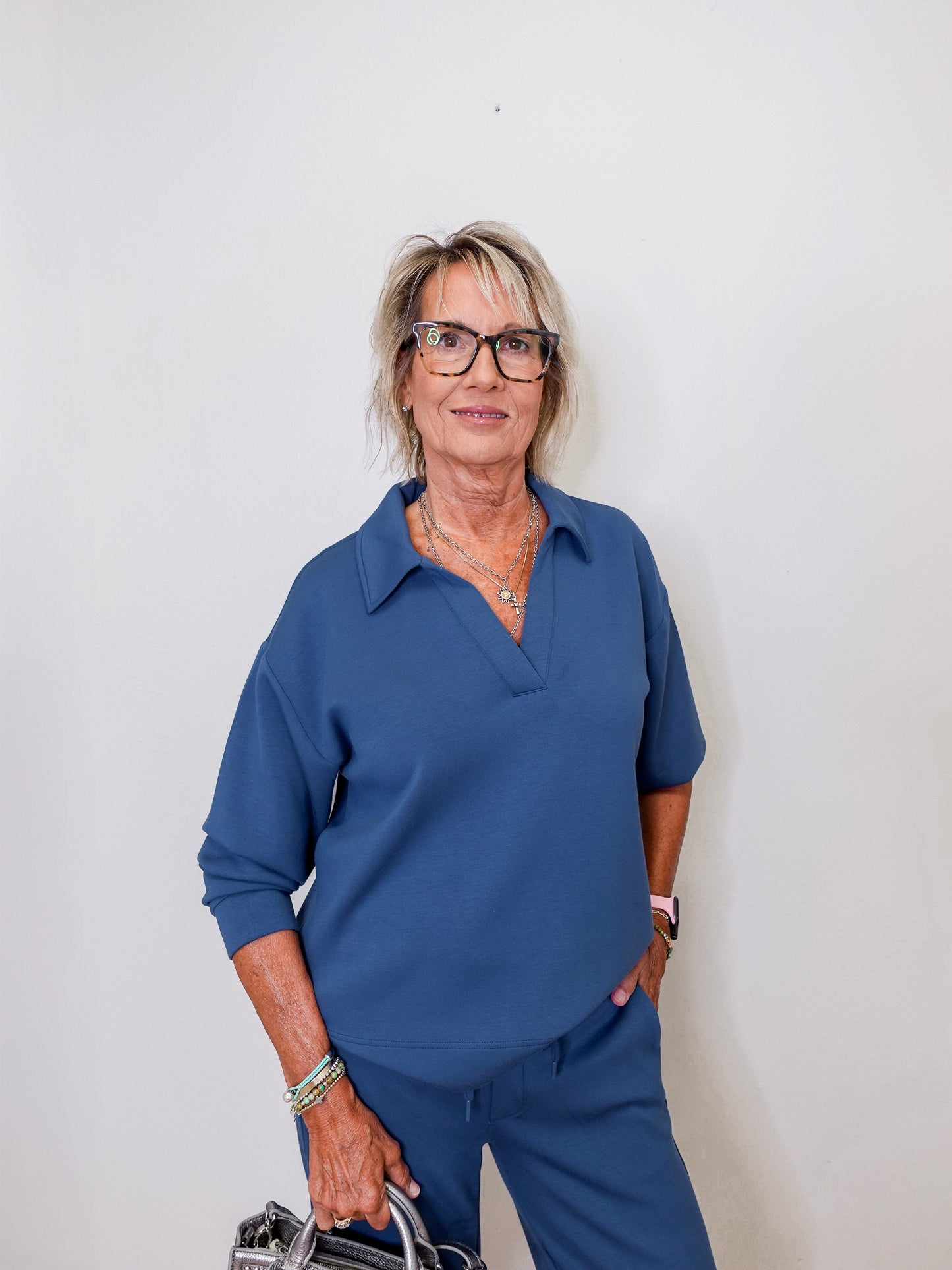 Liverpool V-neck popover collar sweatshirt in pacific blue on female model with white background