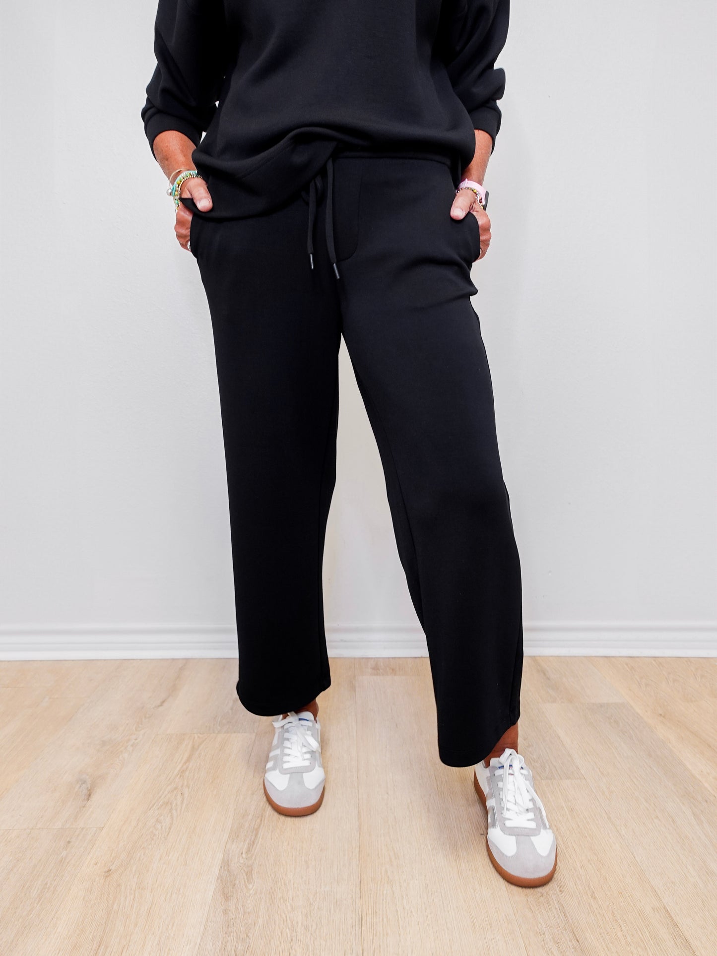 Women wearing Liverpool wide leg crop pant in black.