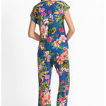 Woman wearing a colorful floral pajama  on a white background