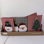 Set of gift card holders with decorative designs in a box on a white surface.