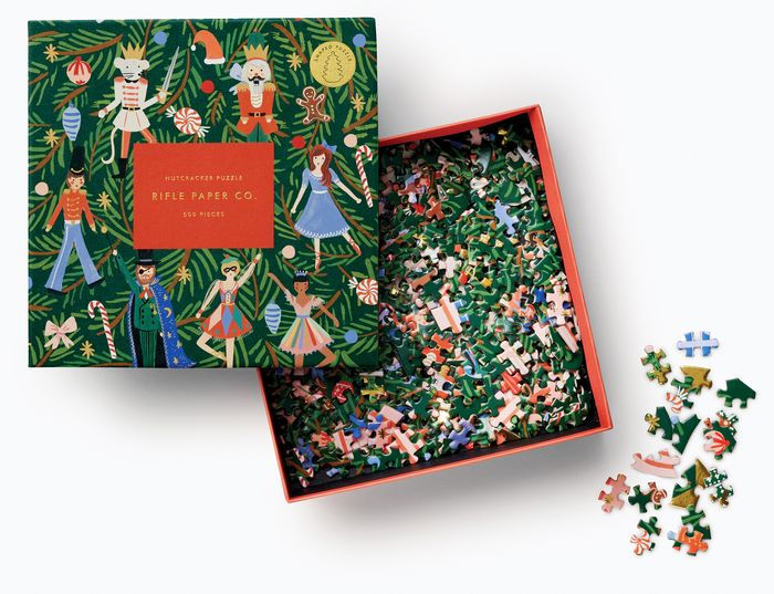 Jigsaw puzzle set with decorative box featuring characters and a Nutcracker theme.