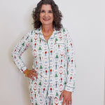 Woman wearing a patterned pajama set against a plain background
