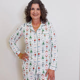Woman wearing a patterned pajama set against a plain background