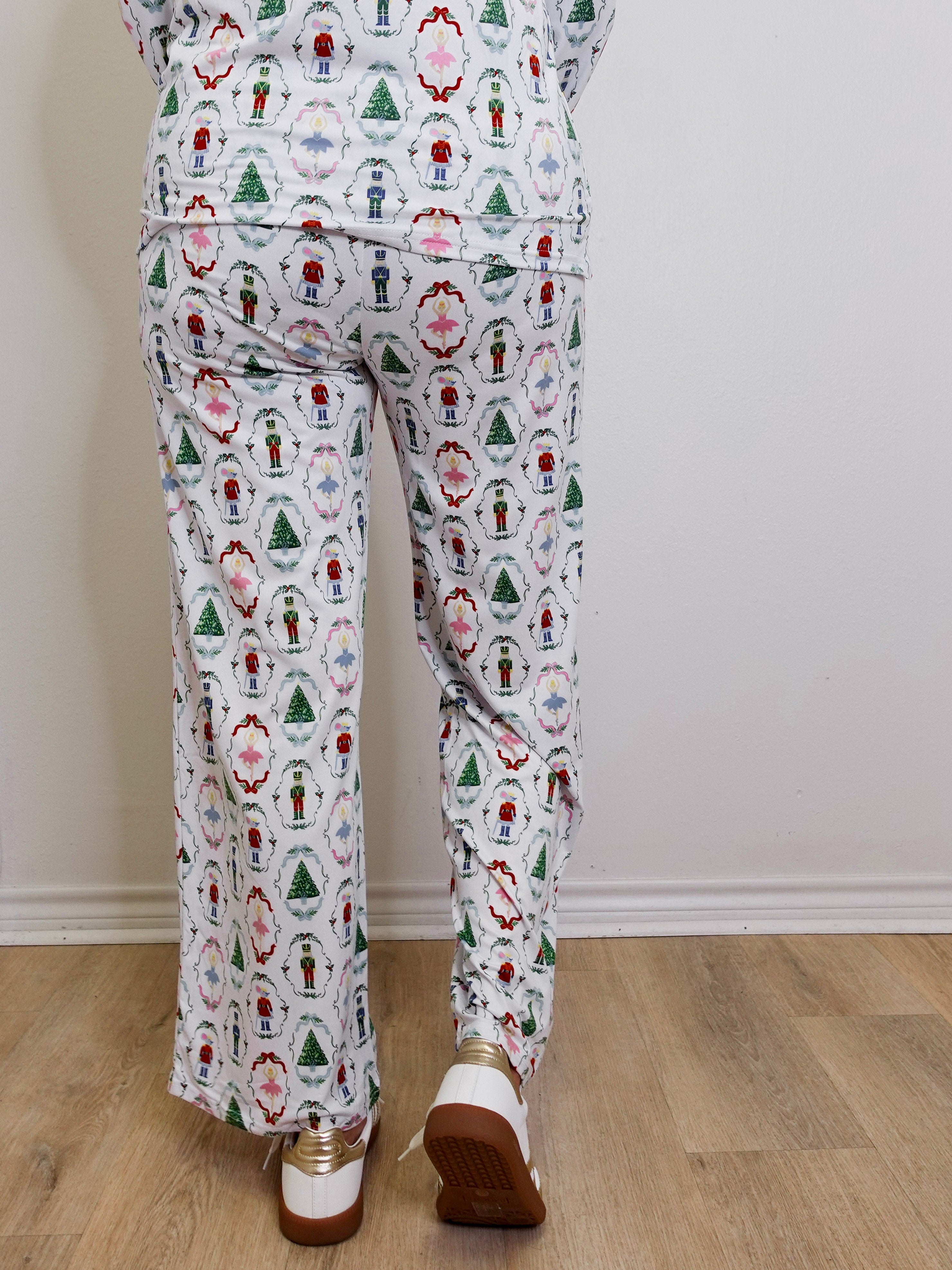 Person wearing a patterned outfit with a neutral background