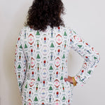 Person wearing a festive pajama set with a white background